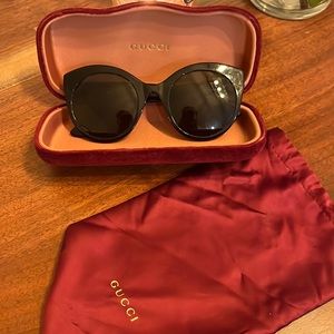 Gucci sunglasses. Case and cover included